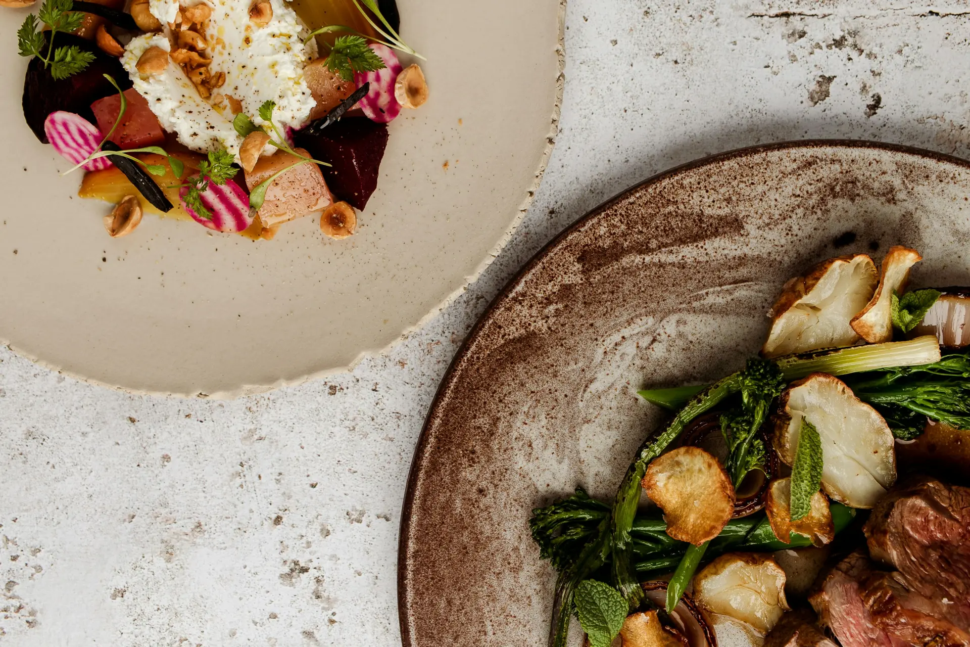 A photograph of two plates with food